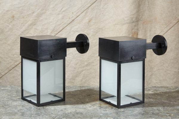 A contemporary, handmade wall lantern in a square design, made to order by HOWE London.