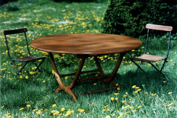 A hugely practical C19th-style folding table by HOWE London, perfect for seasonal outdoor use. Made with a Douglas fir top on oak legs. Also available to order in teak.